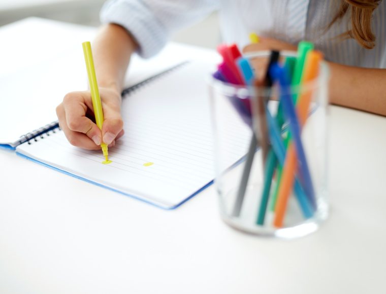 girl-drawing-with-felt-tip-pen-in-notebook.jpg