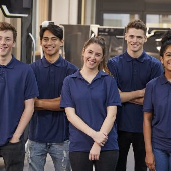 Portrait Of Engineering Apprentices In Factory