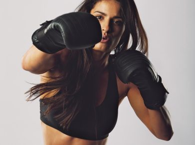 Young sports woman training boxing